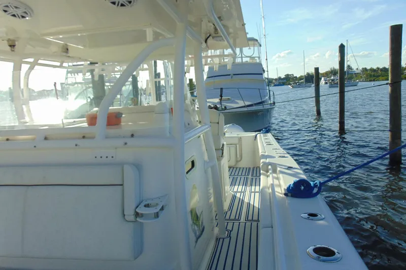 Slide: The Image of 2019 Stamas 390 Tarpon boat docked, featuring spacious deck and sleek design. - 11