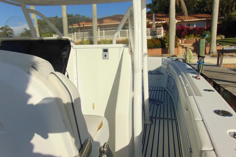 Slide: The Image of 2019 Stamas 390 Tarpon boat interior with seating and deck view. - 12