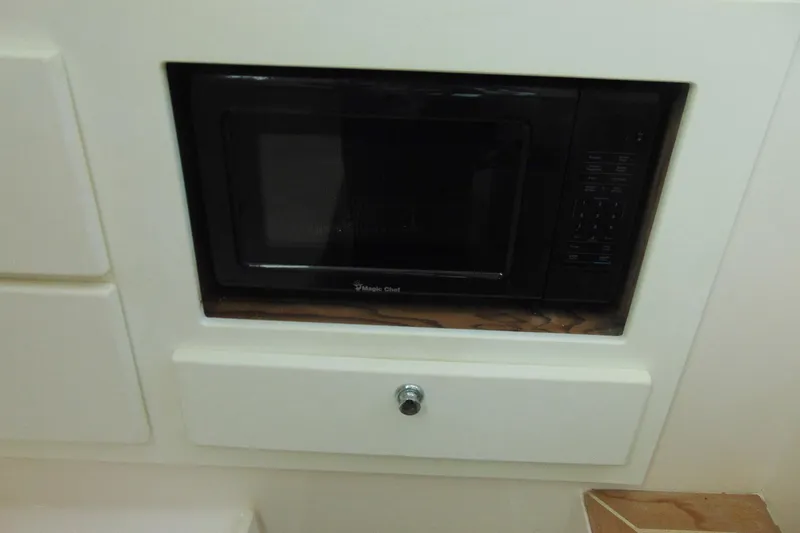 Slide: The Image of Built-in microwave in 2019 Stamas 390 Tarpon boat interior. - 15