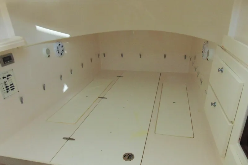 Slide: The Image of 2019 Stamas 390 Tarpon interior cabin with storage compartments and control panel. - 16