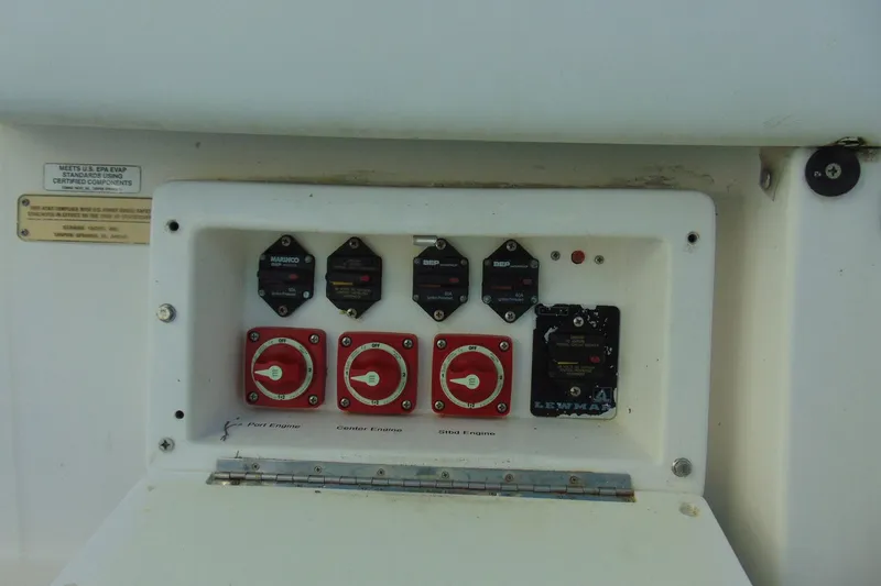 Slide: The Image of Control panel of a 2019 Stamas 390 Tarpon boat with switches and gauges. - 18