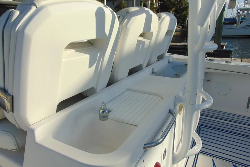 Slide: The Image of 2019 Stamas 390 Tarpon boat interior with white seating and storage compartments. - 24