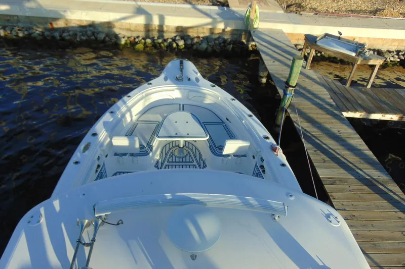 Slide: The Image of 2019 Stamas 390 Tarpon boat docked at a wooden pier, top view. - 26