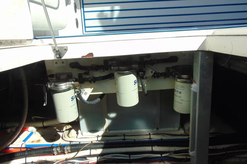 Slide: The Image of Engine compartment of 2019 Stamas 390 Tarpon boat showing fuel filters and wiring. - 33