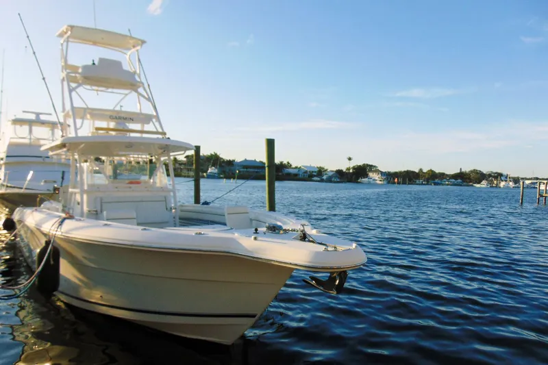 Slide: The Image of 2019 Stamas 390 Tarpon boat docked on a sunny waterfront. - 42