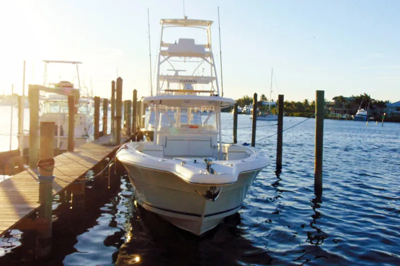 Slide: The Image of 2019 Stamas 390 Tarpon boat docked at marina during sunset. - 43