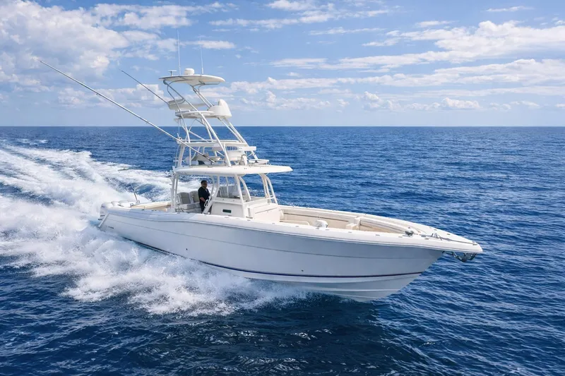 Slide: The Image of 2019 Stamas 390 Tarpon boat cruising on open ocean under blue sky. - 45