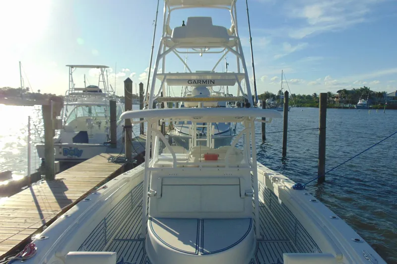 Slide: The Image of 2019 Stamas 390 Tarpon boat docked at marina under clear blue sky. - 9