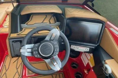 Slide: The Image of 2026 Tigé Z3 boat dashboard with steering wheel and touchscreen display. - 6