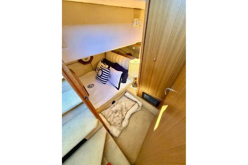 Slide: The Image of 2002 Bayliner 3988 Command Bridge Motoryacht cozy cabin interior with nautical decor. - 19