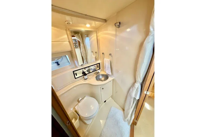 Slide: The Image of Luxurious bathroom in 2002 Bayliner 3988 Command Bridge Motoryacht with modern amenities. - 21