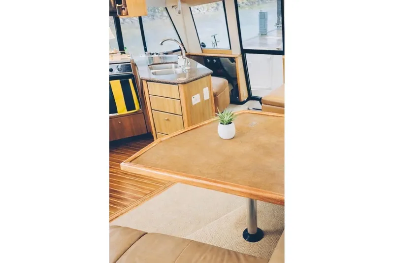 Slide: The Image of Interior of 2002 Bayliner 3988 Command Bridge Motoryacht with kitchen and dining area. - 22