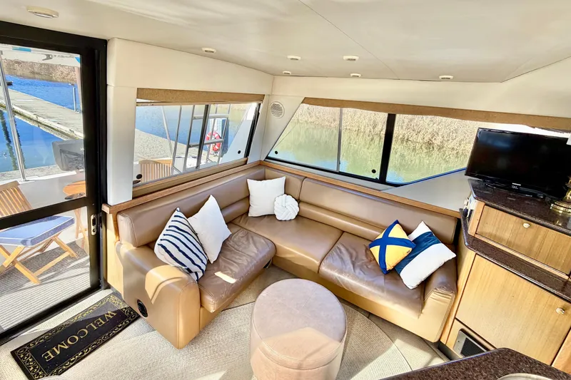 Slide: The Image of Luxurious interior of 2002 Bayliner 3988 Command Bridge Motoryacht with leather seating and scenic views. - 7
