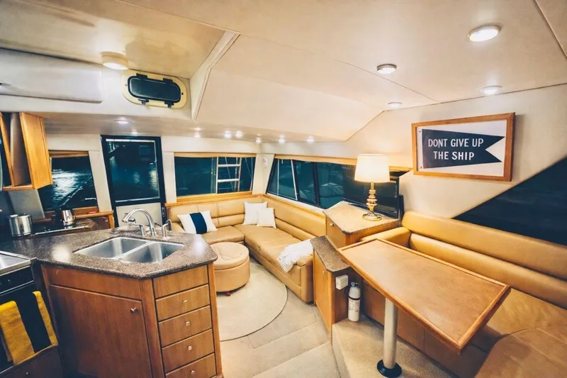 Slide: The Image of Luxurious interior of 2002 Bayliner 3988 Command Bridge Motoryacht with cozy seating and modern amenities. - 8