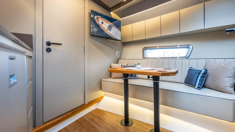 Slide: The Image of Luxurious interior of 2025 Hanover 415 yacht with modern seating and elegant decor. - 13