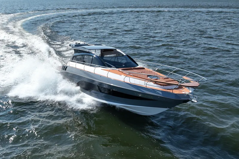 Slide: The Image of Luxurious 2026 Hanover 415 yacht cruising swiftly on open water. - 2