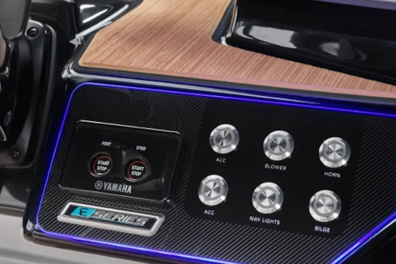 Slide: The Image of Control panel of 2026 Yamaha Boats 222SE with illuminated buttons and wood finish. - 4