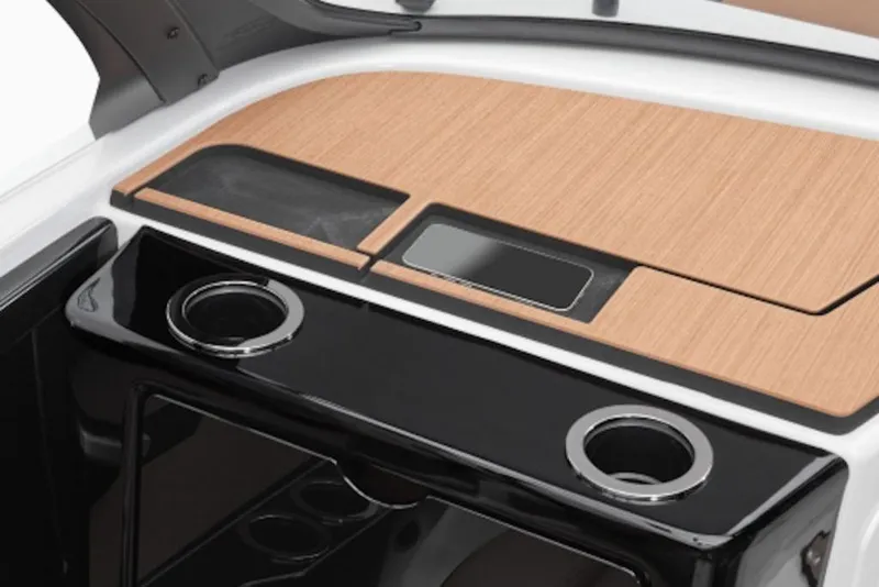 Slide: The Image of 2026 Yamaha Boats 222SE dashboard with wood finish and cup holders. - 9