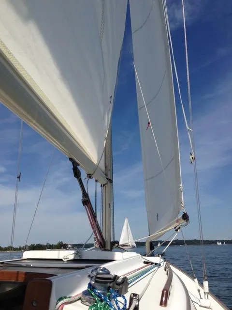 Slide: The Image of Sailing on a 2004 Alerion Express 28 with clear blue skies and calm waters. - 4