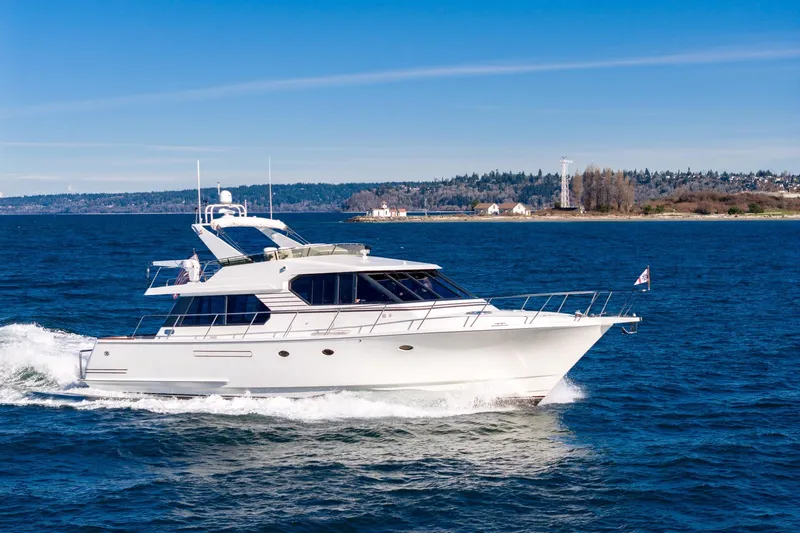 Slide: The Image of 1998 West Bay 58 Sonship Pilothouse MY cruising on open water under clear skies. - 11