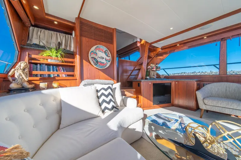 Slide: The Image of Luxurious 1998 West Bay 58 Sonship Pilothouse MY interior with elegant wood finishes and plush seating. - 20