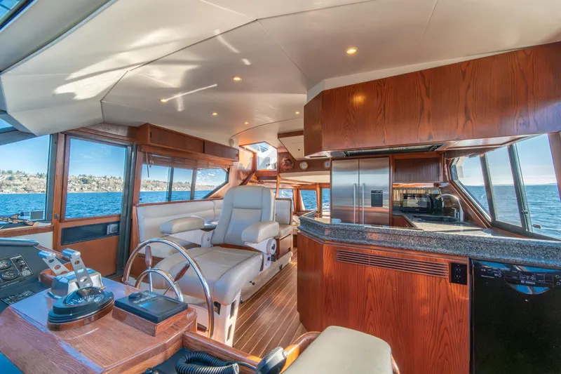Slide: The Image of Luxurious 1998 West Bay 58 Sonship Pilothouse MY interior with elegant wood finishes and ocean view. - 23
