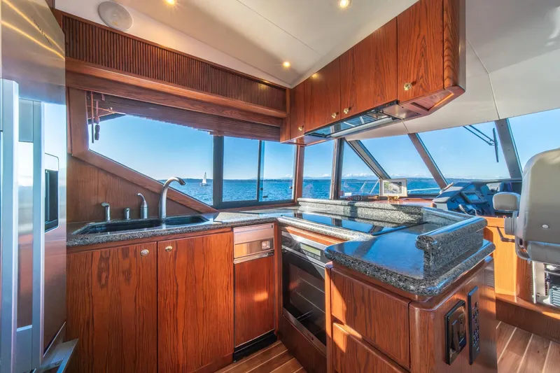 Slide: The Image of Luxurious kitchen interior of 1998 West Bay 58 Sonship Pilothouse MY yacht with ocean view. - 24