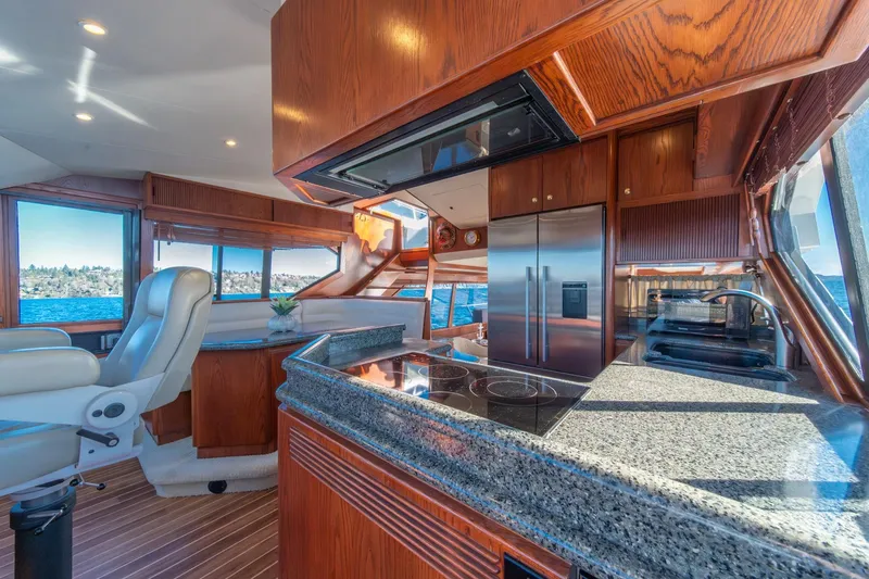 Slide: The Image of Luxurious 1998 West Bay 58 Sonship Pilothouse MY interior with modern kitchen and scenic views. - 25