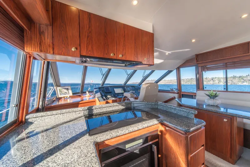 Slide: The Image of Luxurious interior of 1998 West Bay 58 Sonship Pilothouse MY with panoramic ocean views. - 26