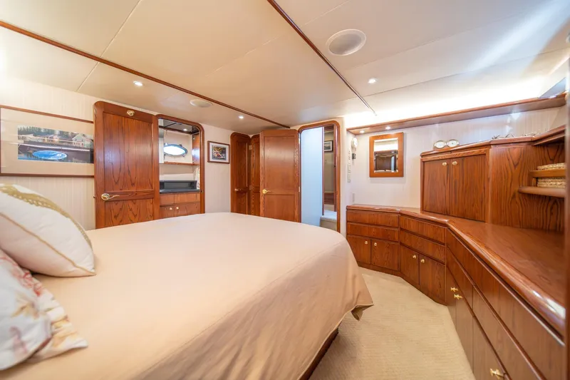 Slide: The Image of Luxurious 1998 West Bay 58 Sonship Pilothouse MY bedroom with elegant wood cabinetry. - 31