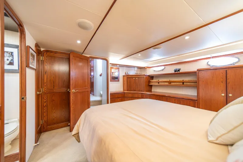 Slide: The Image of Luxurious 1998 West Bay 58 Sonship Pilothouse MY bedroom with elegant wood cabinetry. - 32