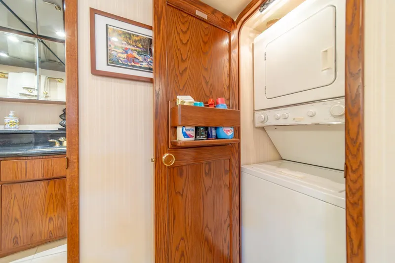Slide: The Image of Laundry area in 1998 West Bay 58 Sonship Pilothouse MY yacht with wooden cabinetry. - 37