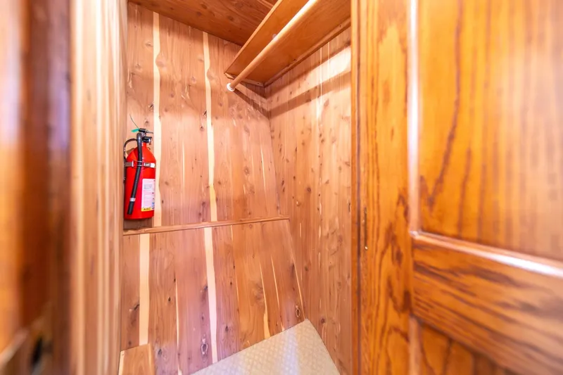 Slide: The Image of Wooden closet interior with fire extinguisher on West Bay 58 Sonship Pilothouse MY, 1998. - 38