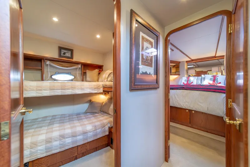 Slide: The Image of 1998 West Bay 58 Sonship Pilothouse MY interior with cozy bunk beds and elegant bedroom. - 43