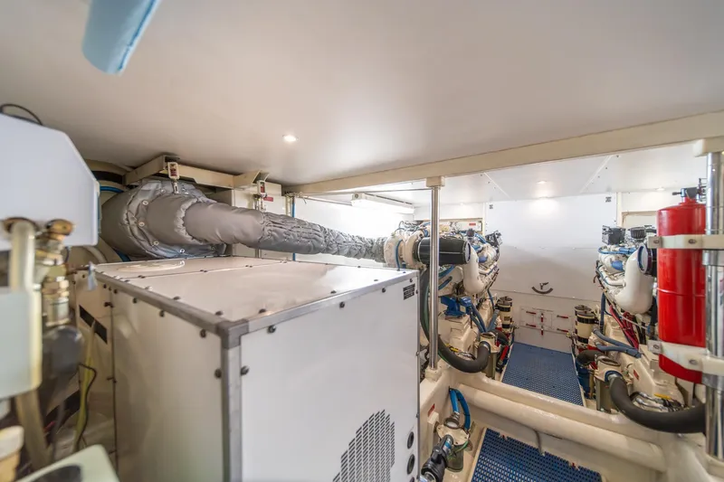 Slide: The Image of Engine room of 1998 West Bay 58 Sonship Pilothouse MY, showcasing machinery and equipment. - 60