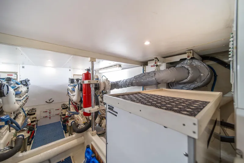Slide: The Image of Engine room of 1998 West Bay 58 Sonship Pilothouse MY, featuring dual engines and equipment. - 61