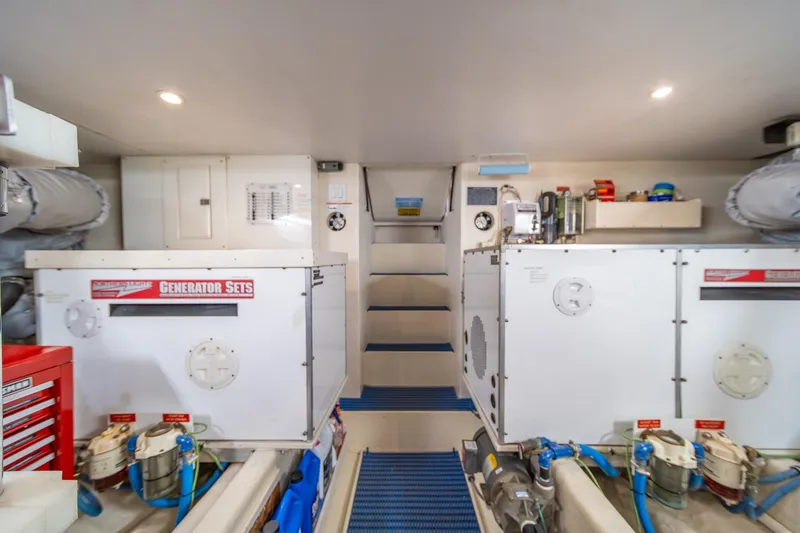 Slide: The Image of Engine room of 1998 West Bay 58 Sonship Pilothouse MY with generator sets. - 68