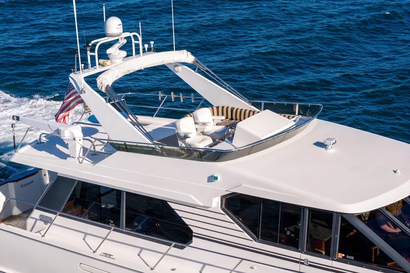 Slide: The Image of 1998 West Bay 58 Sonship Pilothouse MY cruising on open water. - 9