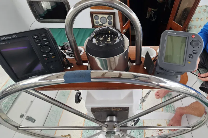 Slide: The Image of Steering wheel and navigation instruments on a 1979 CSY 44 CC sailboat. - 10