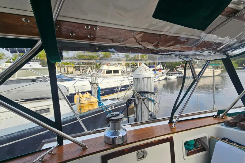 Slide: The Image of Cockpit view from 1979 CSY 44 CC sailboat docked at marina with other boats. - 11