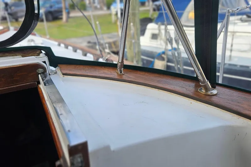 Slide: The Image of 1979 CSY 44 CC yacht cockpit detail with wood trim and metal supports. - 14