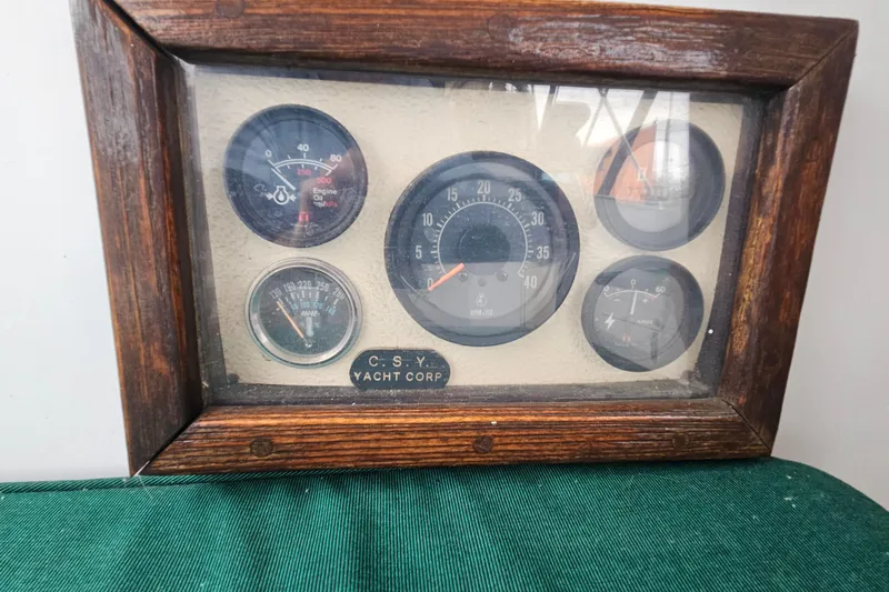 Slide: The Image of Vintage 1979 CSY 44 CC yacht instrument panel with wooden frame and gauges. - 17