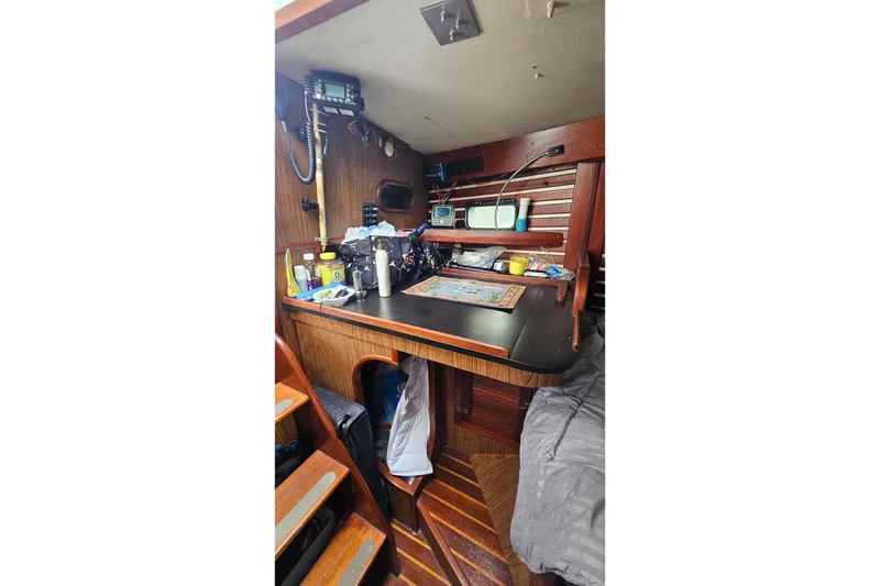 Slide: The Image of 1979 CSY 44 CC yacht interior with navigation equipment and wooden cabinetry. - 20