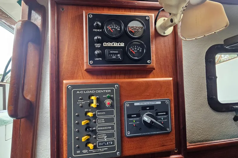 Slide: The Image of Control panel of a 1979 CSY 44 CC sailboat with gauges and switches. - 25