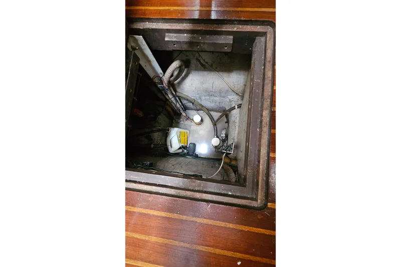 Slide: The Image of Bilge compartment of 1979 CSY 44 CC sailboat with visible wiring and equipment. - 27