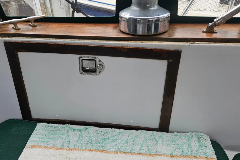 Slide: The Image of 1979 CSY 44 CC sailboat interior with wooden trim and winch. - 39
