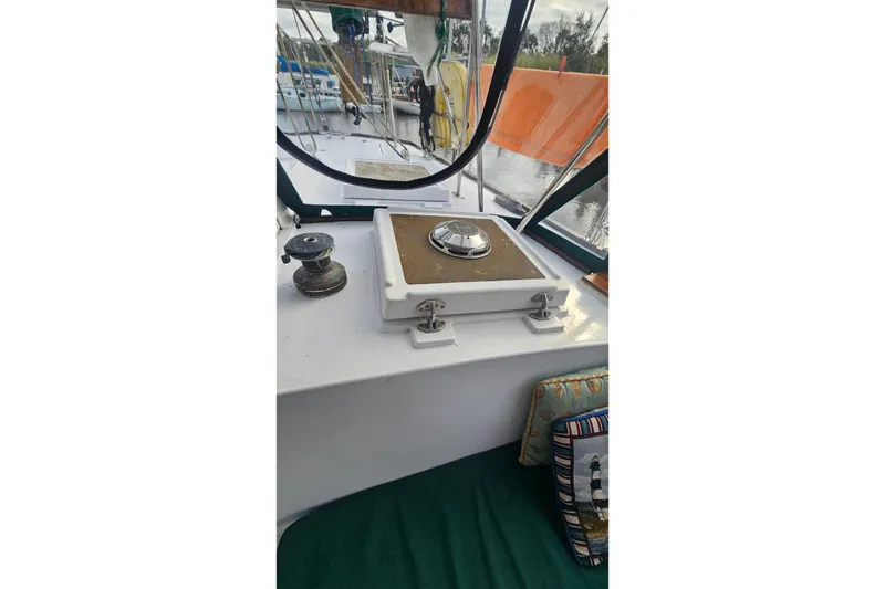 Slide: The Image of 1979 CSY 44 CC yacht cockpit with winch and hatch, featuring nautical decor. - 41