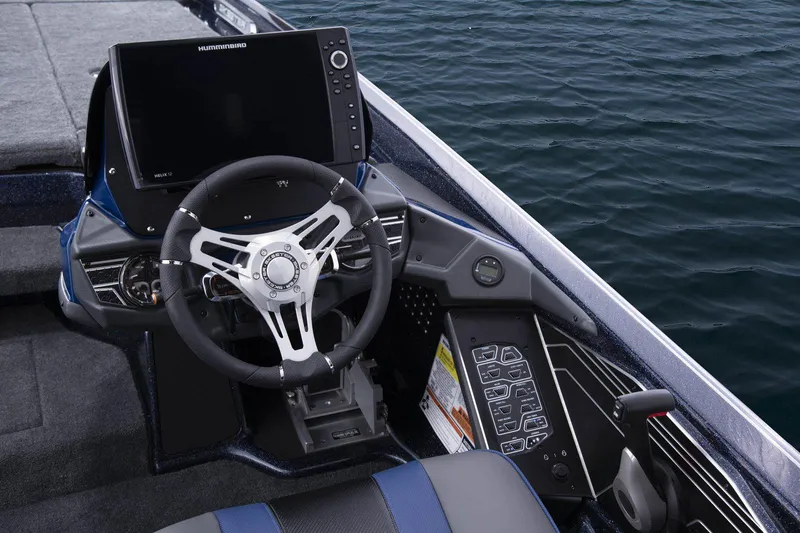 Slide: The Image of Manufacturer Provided Image: 2021 Skeeter FXR 21 boat dashboard with steering wheel and navigation system. - 8
