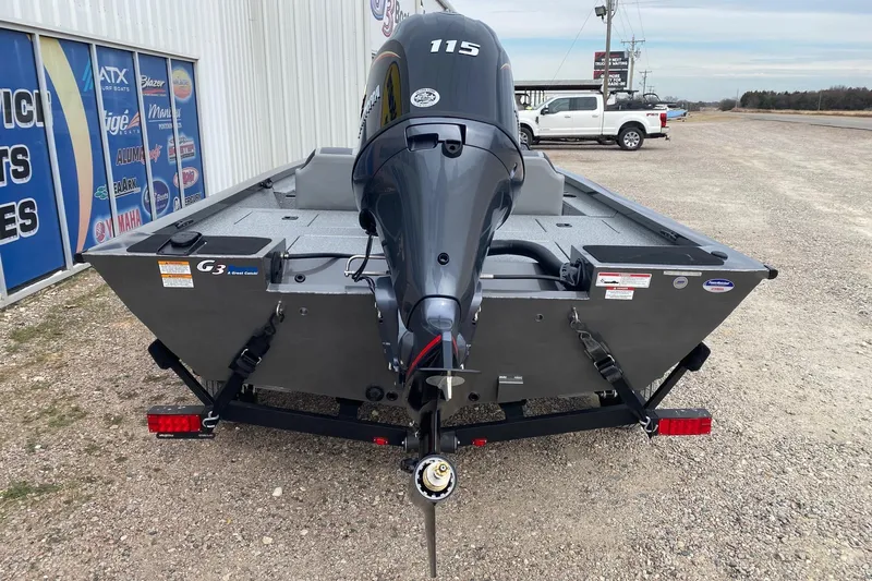 Slide: The Image of 2026 G3 Sportsman 1810 PFX boat with powerful outboard motor, parked outdoors. - 5