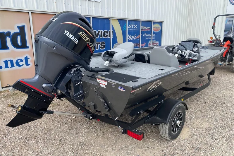 Slide: The Image of 2026 G3 Sportsman 1810 PFX boat with Yamaha engine, parked on a trailer. - 6